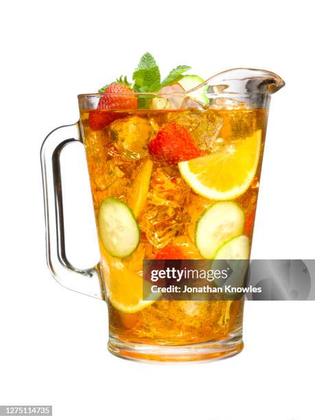 pitcher of iced tea and fruit - jug stock pictures, royalty-free photos & images