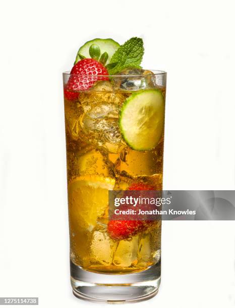 glass of iced tea with fruit - cocktail isolated stock-fotos und bilder