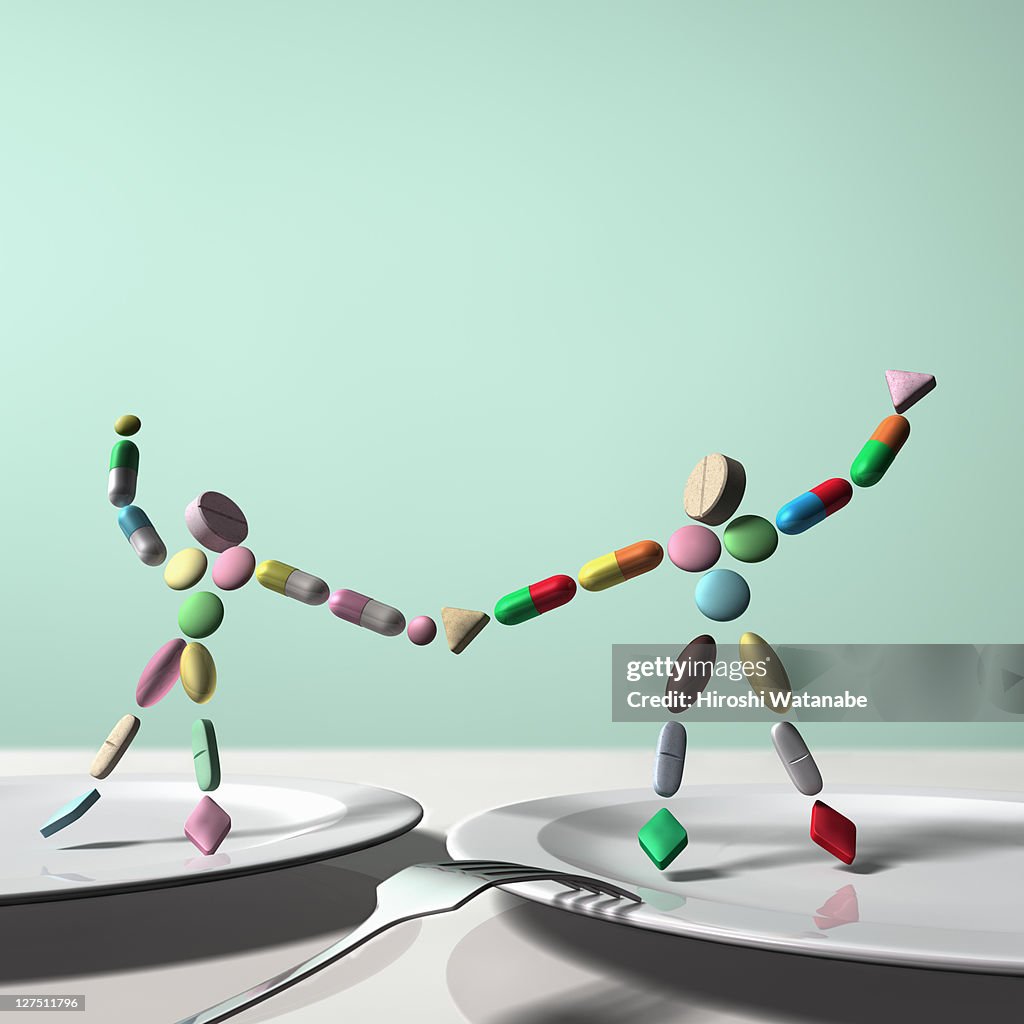 Pill Couple Dancing On The Dish High-Res Stock Photo - Getty Images