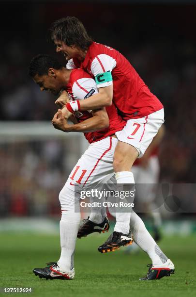 Andre Santos of Arsenal celebrates with Tomas Rosickyas he scores their second goal during the UEFA Champions League Group F match between Arsenal...