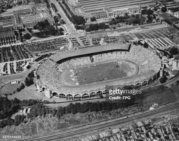 Aerial view of the Empire Stadium, showing 100,000 spectators watching the events on the third day of the 1948 Summer Olympics in London, England,...