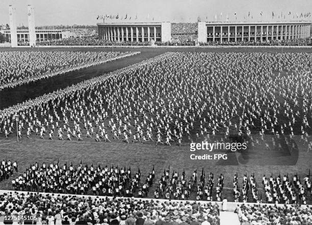 High angle view of German youths during an exercise demonstration at the Maifeld in the Olympiapark, during the 1936 Summer Olympics in Berlin,...