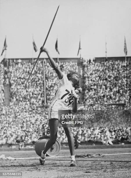 American athlete Theresa Manuel competes in the women's javelin throw event of the 1948 Summer Olympics, at the Empire Stadium in Wembley, London,...