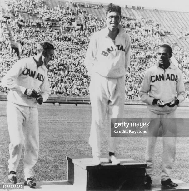 Canadian athlete Alex Wilson , British athlete Tommy Hampson , and Canadian athlete Phil Edwards on the podium after the final of the Men's 800...