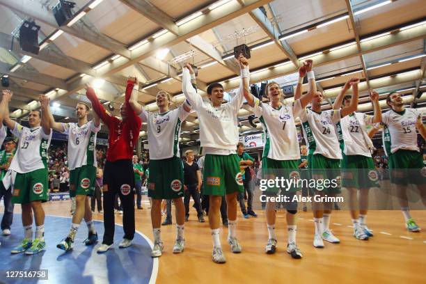 Players of Goeppingen celebrate after the Toyota Handball Bundesliga match between Frisch Auf Goeppingen and Fuechse Berlin at EWS Arena on September...