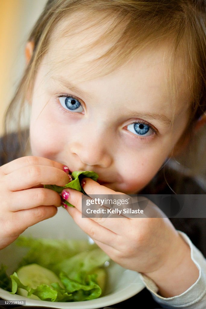 Girl eating salad