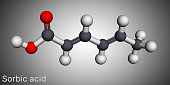 Sorbic acid, 2,4-hexadienoic acid, E200 molecule. It is hexadienoic and polyunsaturated fatty acid. It is conjugate acid of sorbate. Molecular model