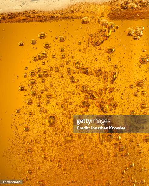 close up beer bubbles - beer close up stock pictures, royalty-free photos & images