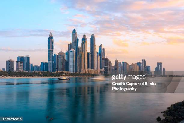 dubai marina from the sea side during sunset - dubai stock pictures, royalty-free photos & images
