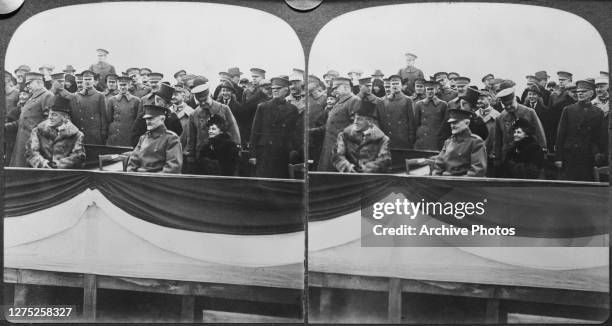 President Woodrow Wilson with his wife Edith , General Pershing and officers in the viewing stand at Chaumont, France, on Christmas Day 1918.