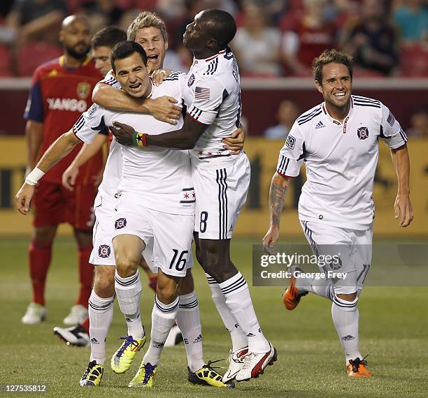 Marco Pappa of the Chicago Fire celebrates his goal with Dominic Oduro, Logan Pause and Daniel PalaDini during a game against Real Salt Lake during...