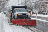 Snowblower Truck cleaning road during the blizzard snow storm