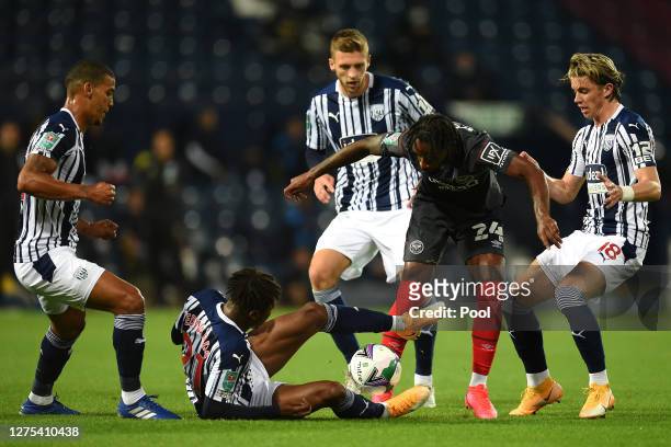 Tariqe Fosu-Henry of Brentford FC is challenged by Kyle Edwards of West Bromwich Albion during the Carabao Cup Third Round match between West...