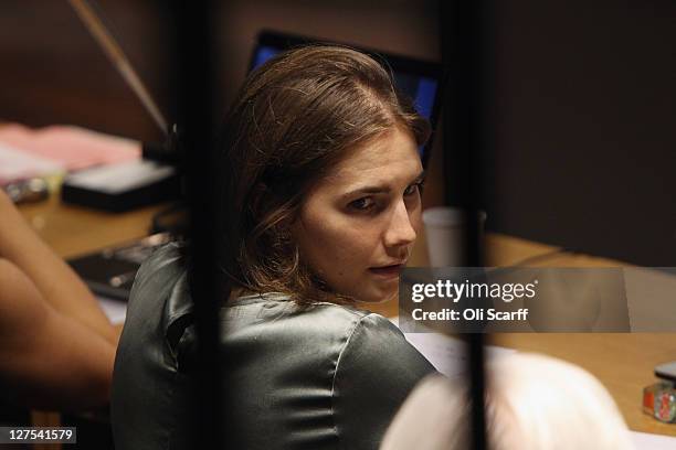 Amanda Knox looks at her lawyer Luciano Ghirga as she attends her appeal hearing at Perugia's Court of Appeal on September 29, 2011 in Perugia,...