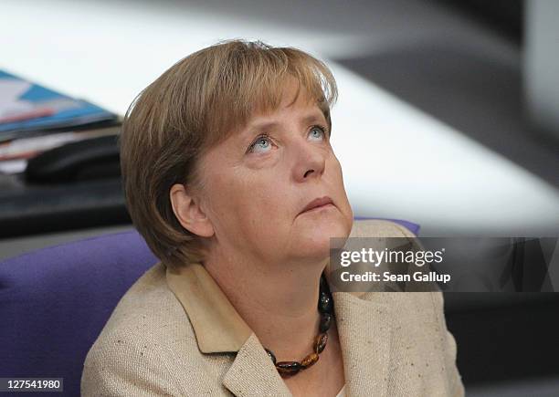 German Chancellor Angela Merkel attends a session of the Bundestag in which members will vote on an increase in funding for the European Financial...