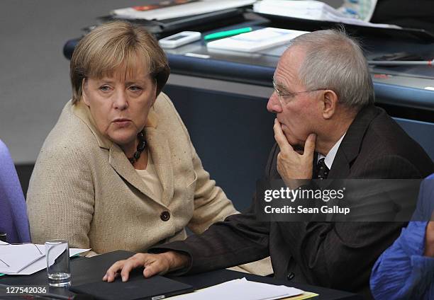 German Chancellor Angela Merkel and Finance Minister Wolfgang Schaeuble attend a session of the Bundestag in which members will vote on an increase...