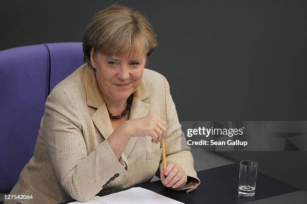 German Chancellor Angela Merkel attends a session of the Bundestag in which members will vote on an increase in funding for the European Financial...