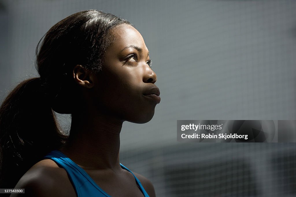 Woman looking up into light