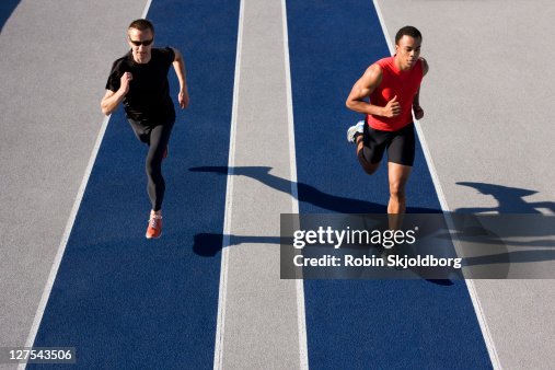 Runners racing on track Runners racing on track