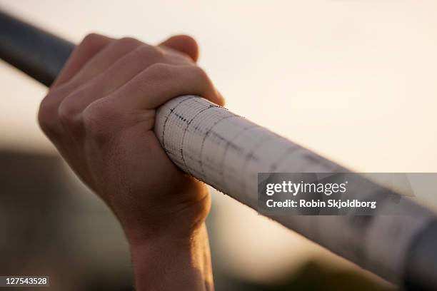 close up of man holding pole - javelin stock pictures, royalty-free photos & images