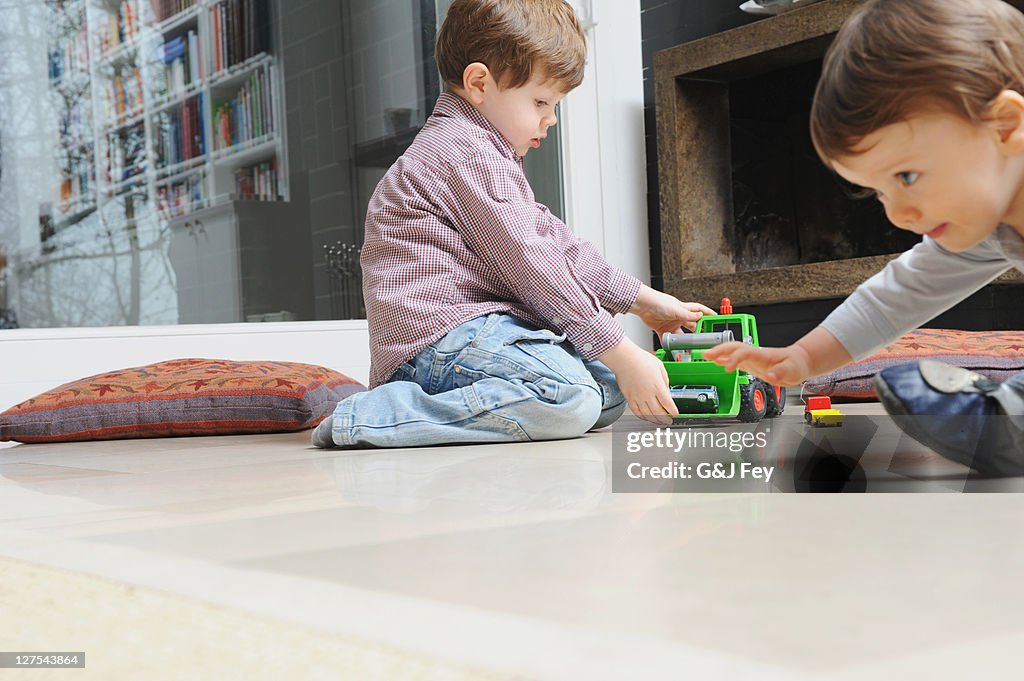 Boy playing with toy cars