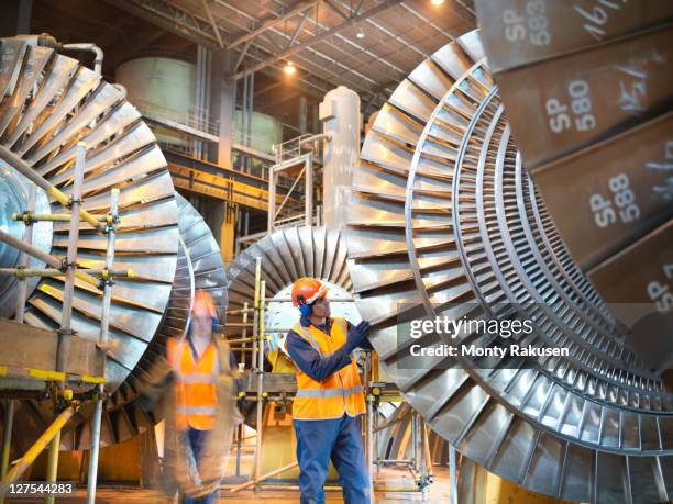 workers with turbines in power station - turbine generator stock pictures, royalty-free photos & images