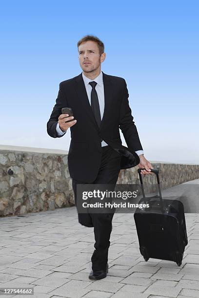 businessman running with luggage - hermanus stock pictures, royalty-free photos & images