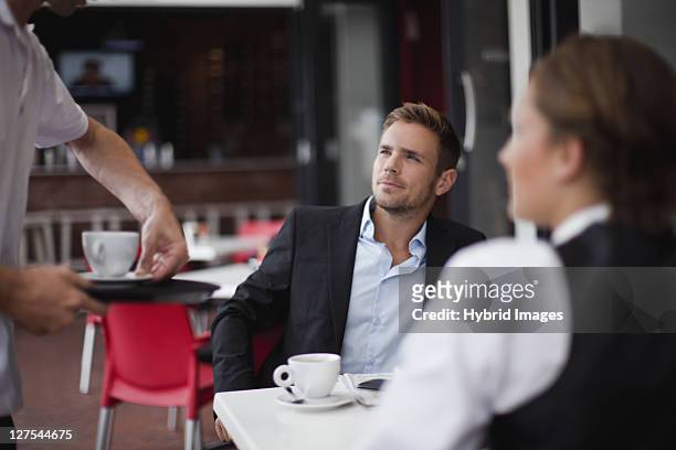 business people having coffee together - hermanus stock pictures, royalty-free photos & images