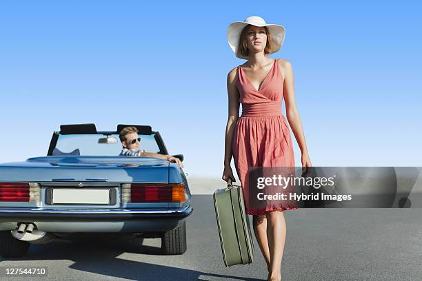 woman leaving man in convertible - hermanus stock pictures, royalty-free photos & images