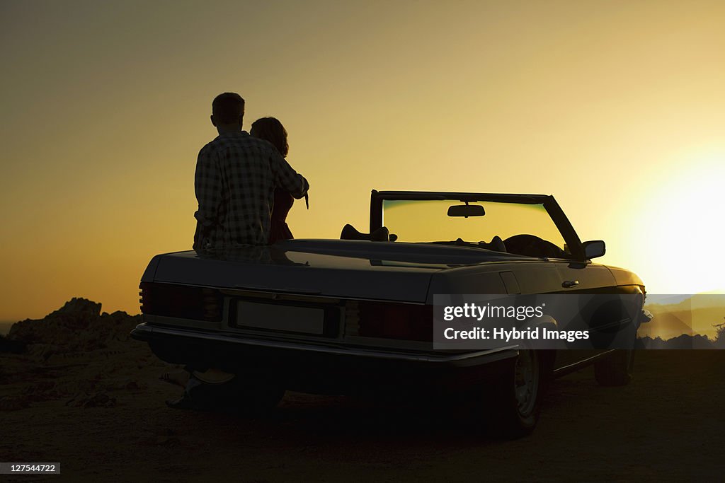 Couple admiring view on convertible