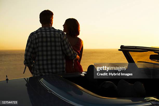 couple admiring view on convertible - hermanus stock pictures, royalty-free photos & images