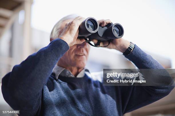 businessman looking through binoculars - binocular with man stock pictures, royalty-free photos & images