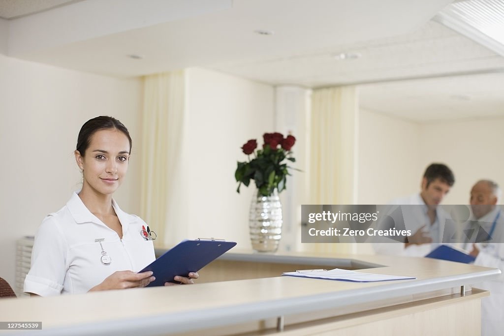 Nurse working at hospital reception