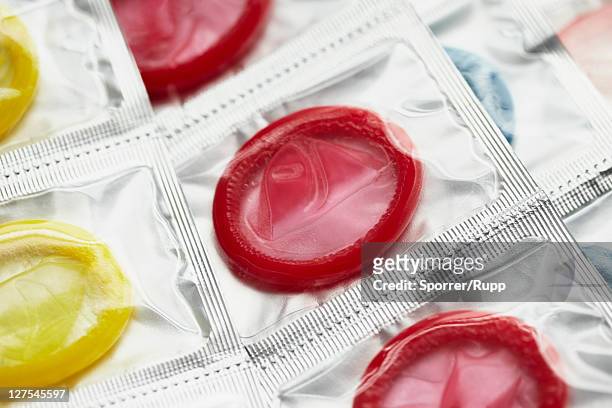 close up of colorful condoms - condoms stock pictures, royalty-free photos & images