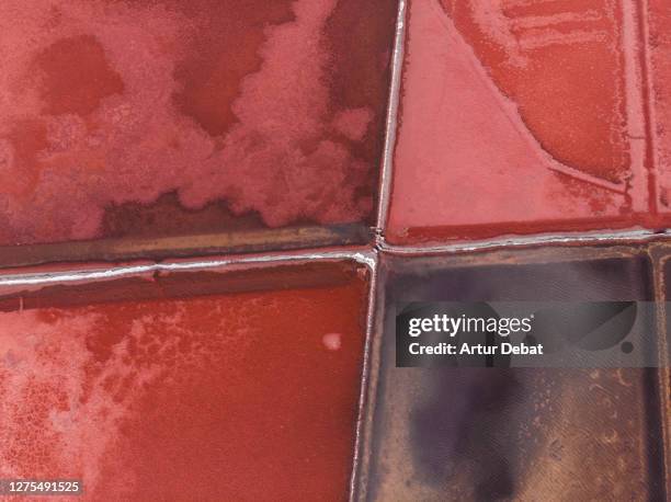 beautiful aerial view of red salt flat pattern in the nature. - alkaline food stock pictures, royalty-free photos & images