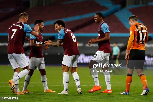 Sebastian Haller of West Ham celebrates with teammates after scoring his sides second goal during the Carabao Cup Third Round match between West Ham...