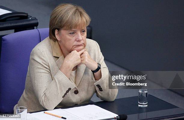 Angela Merkel, Germany's chancellor, reacts ahead of a vote to expanded the powers of the European Financial Stability Facility , in the lower-house...