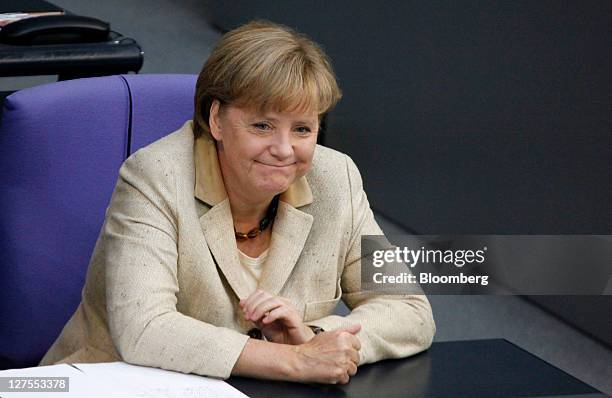 Angela Merkel, Germany's chancellor, reacts ahead of a vote to expanded the powers of the European Financial Stability Facility , in the lower-house...