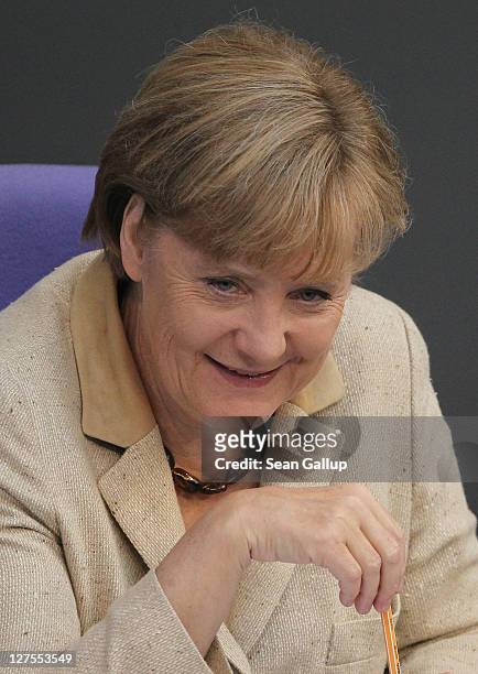 German Chancellor Angela Merkel attends a session of the Bundestag in which members will vote on an increase in funding for the European Financial...