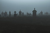 Spooky graveyard at night