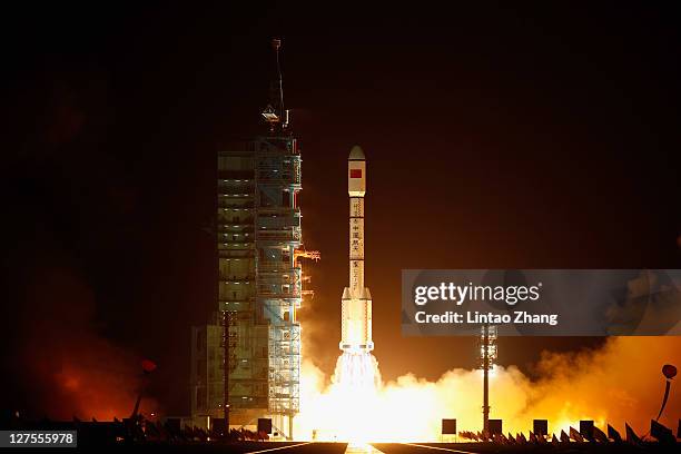 Long March 2F rocket carrying the country's first space laboratory module Tiangong-1 lifts off from the Jiuquan Satellite Launch Center on September...