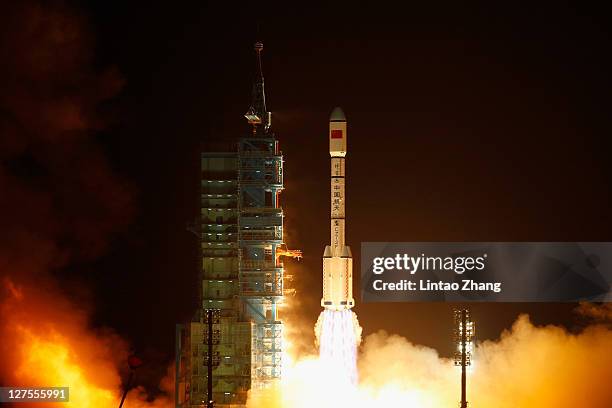 Long March 2F rocket carrying the country's first space laboratory module Tiangong-1 lifts off from the Jiuquan Satellite Launch Center on September...