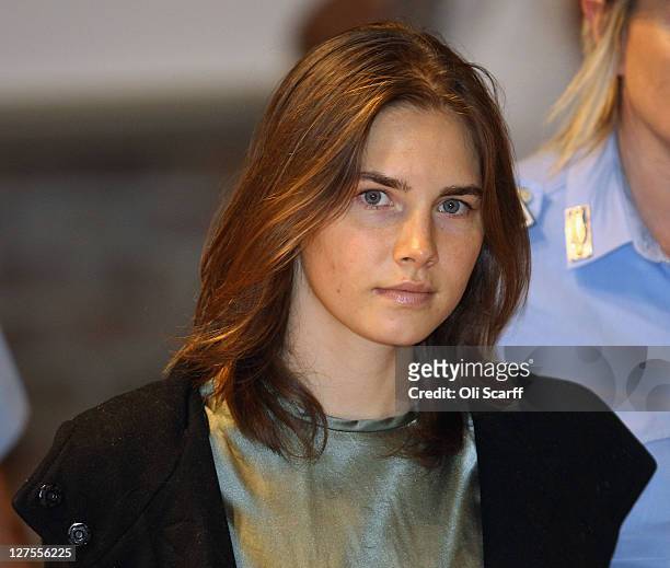 Amanda Knox is escorted to her appeal hearing at Perugia's Court of Appeal on September 29, 2011 in Perugia, Italy. Amanda Knox and Raffaele...