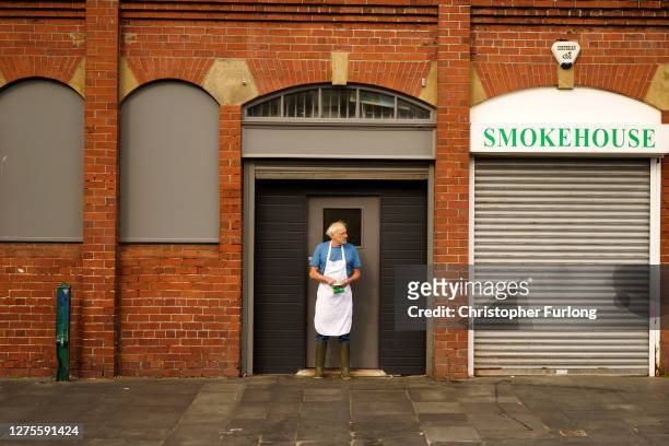 Worker takes a smoke break in North Shields on September 19, 2020 in Newcastle upon Tyne, United Kingdom. Since easing its first nationwide lockdown...