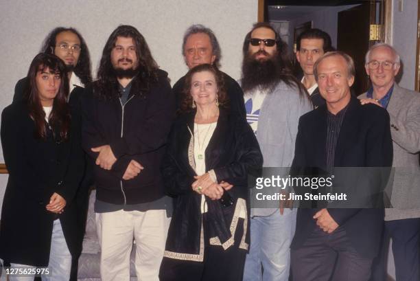 Johnny Cash and June Carter Cash pose with Rick Rubin, Lou Robin and others backstage at the Greek Theatre in Los Angeles, California on June 14,...
