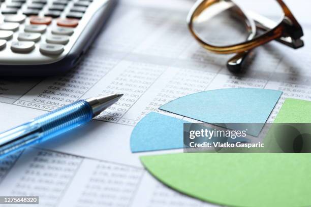 accounting and financial planning with pie chart and spreadsheets - accounting calculator stock pictures, royalty-free photos & images
