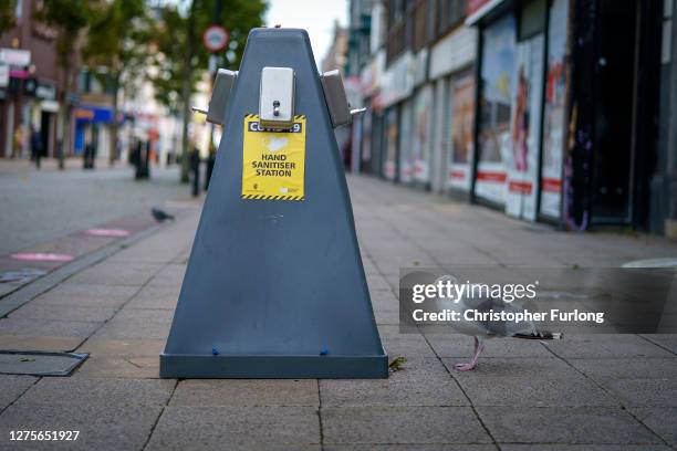 Hand gel dispensers sit in the quiet High Street on September 20, 2020 in South Shields, United Kingdom. Since easing its first nationwide lockdown...