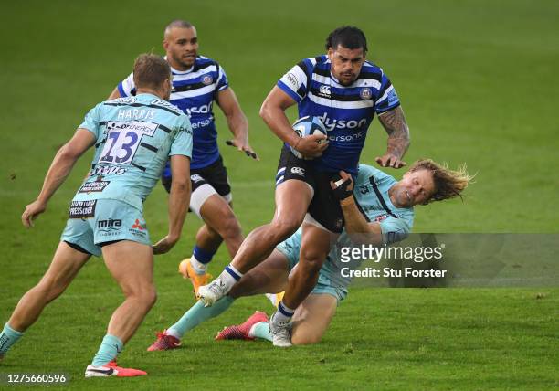 Bath player Josh Matavesi breaks the tackle of Billy Twelvetrees during the Gallagher Premiership Rugby match between Bath Rugby and Gloucester Rugby...