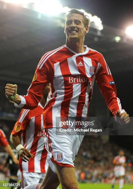 Peter Crouch of Stoke City celebrates scoring his team's first goal during the UEFA Europa League Group E match between Stoke City and Besiktas JK at...