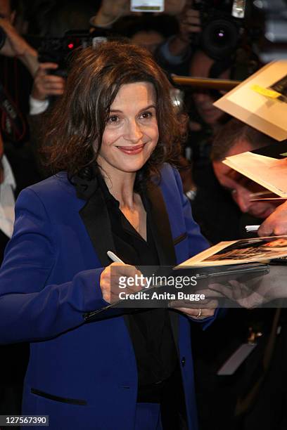 French actress Juliette Binoche signs autographs at the "Copie Conforme" Germany Premiere at the Cinema Paris Berlin on September 29, 2011 in Berlin,...